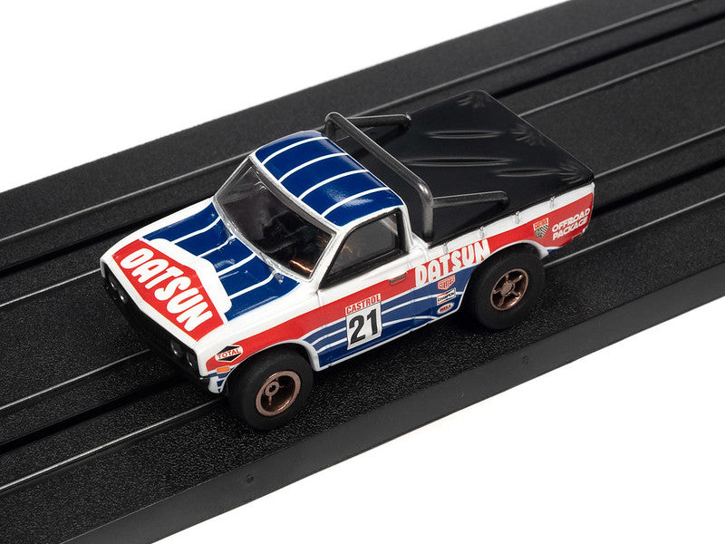 Auto World Slot Cars, 1975 Datsun 620 Pickup Truck (New Casting) (X-traction) Although not originally designed for rally racing, the 1975 Datsun 620 pickup truck was a popular choice for rally enthusiasts due to its light weight and nimble handling.