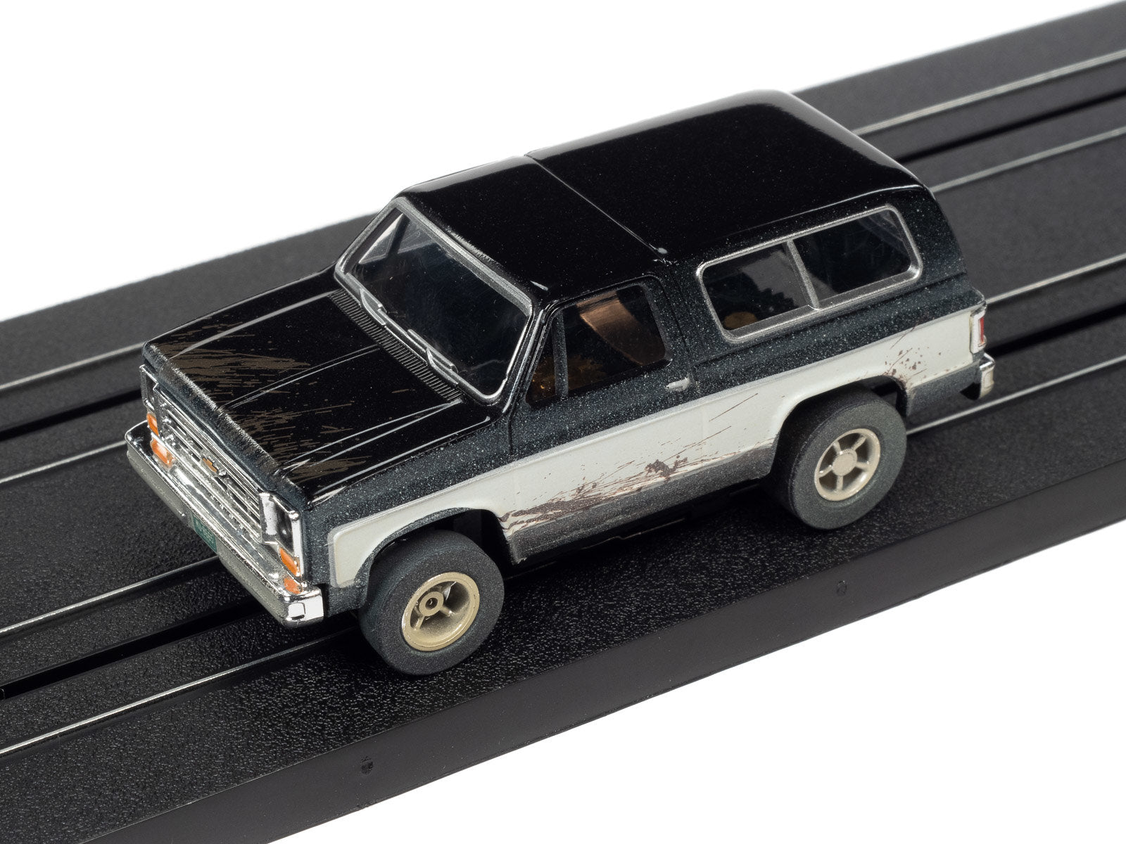 Auto World Slot Cars, Off Road Series - 1977 Chevy Blazer - Release 1 2022 - Version B. Pictured on race track.